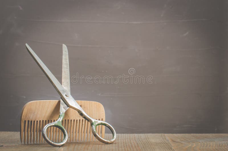 Barbershop concept. Old style. Hairbrushes and a scissors on a gray background with copy space. Selective focus