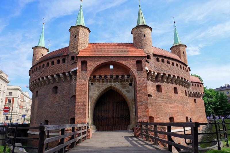 Cracow barbican `Barbakan` - famous medieval fortification at city walls, Krakow, Poland. Cracow barbican `Barbakan` - famous medieval fortification at city walls, Krakow, Poland