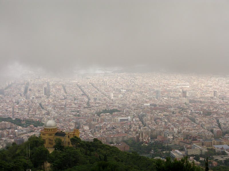 Barcelona clouds regn under royaltyfria bilder