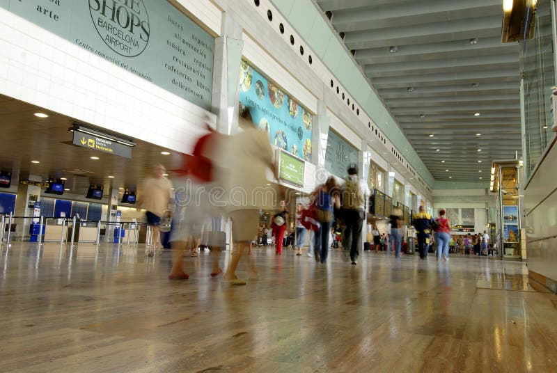 Motion blur image of people at barcelona airport. Motion blur image of people at barcelona airport