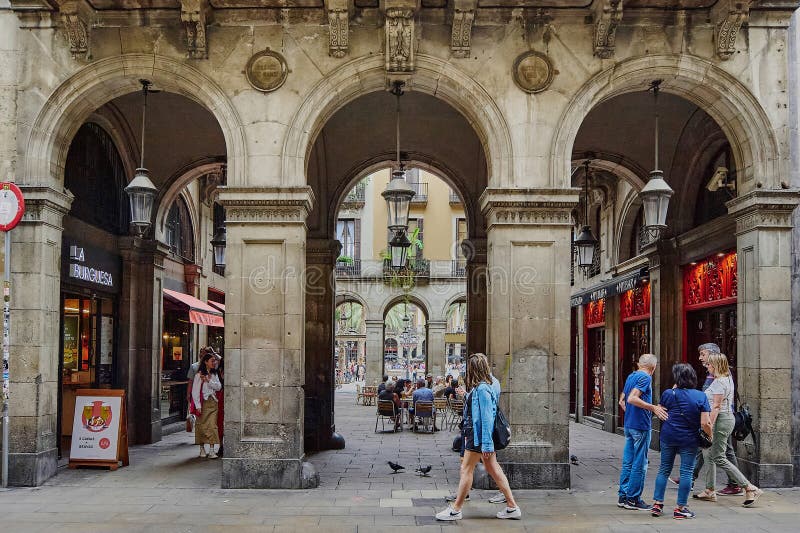 Barcelona - June 11, 2023: Majestic arches, exploring the beauty of the passage that leads to the royal square of