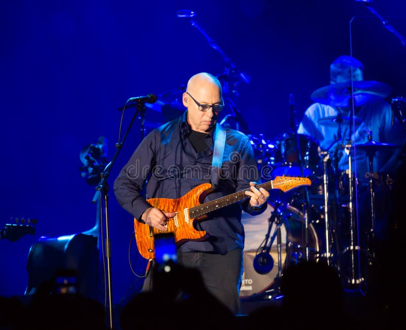 BARCELONA, SPAIN - APRIL 26, 2019: British rock musician, guitarist, vocalist and songwriter for Dire Straits Mark Knopfler giving concert at Palau Sant Jordi