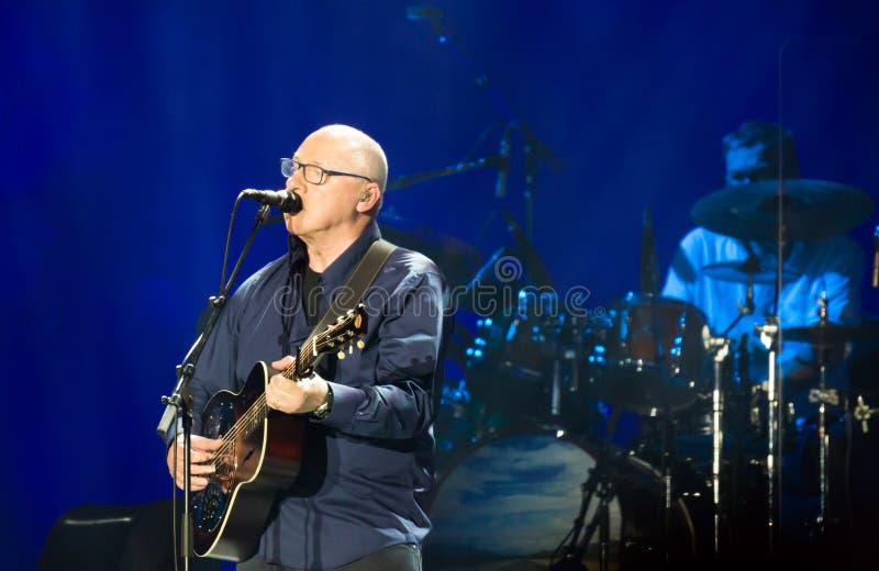 BARCELONA, SPAIN - APRIL 26, 2019: Mark Knopfler performing live on stage of famous Palau Sant Jordi. BARCELONA, SPAIN - APRIL 26, 2019: Mark Knopfler performing live on stage of famous Palau Sant Jordi