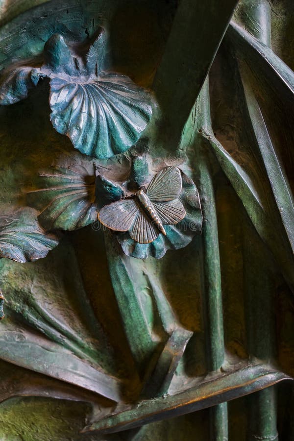 Elements of insects, flowers, birds of mammals on the old entrance gate to the Temple of the Holy Family.