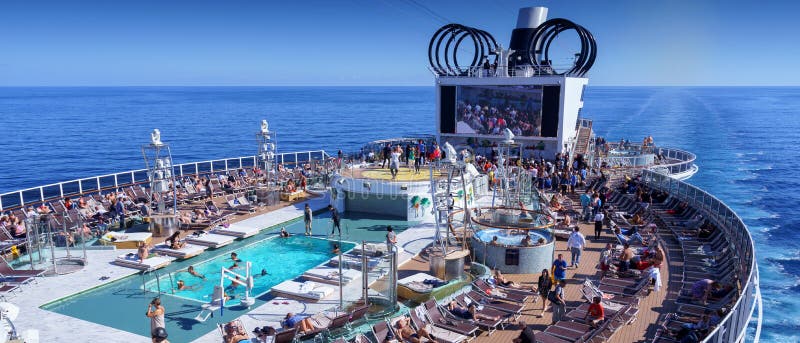 BARCELONA, SPAIN- 06 NOVEMBER, 2018: An aerial view of a cruise ship pool area with people in the open sea royalty free stock photo BARCELONA, SPAIN- 06 NOVEMBER, 2018: An aerial view of a cruise ship pool area with people in the open sea royalty free stock photo