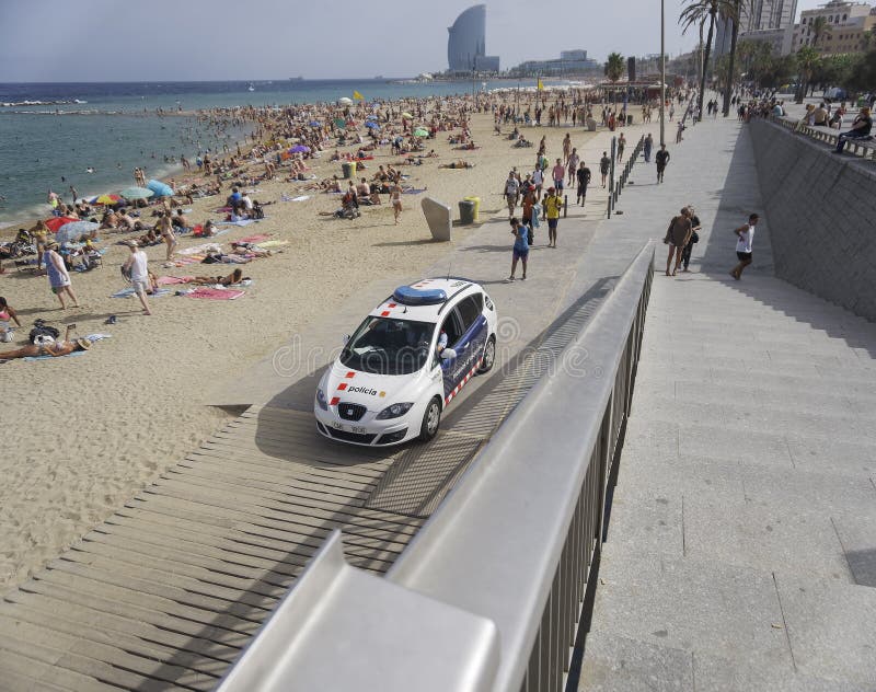 Barcelona, Spain Police car on Barceloneta beach.