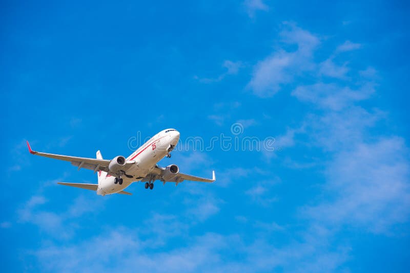 BARCELONA, SPAIN - AUGUST 20, 2016: Airplane in the sky over Barcelona. Copy space for text. BARCELONA, SPAIN - AUGUST 20, 2016: Airplane in the sky over Barcelona. Copy space for text