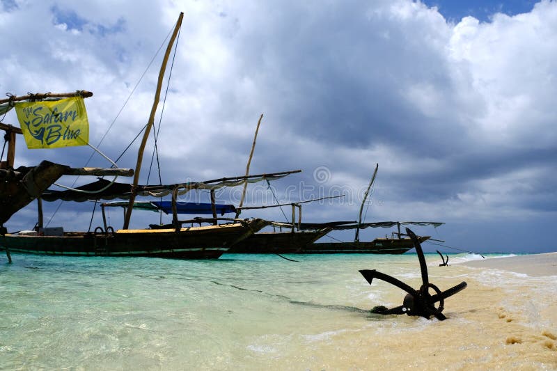 boat on the beach with anchor Zanzibar with sky. boat on the beach with anchor Zanzibar with sky