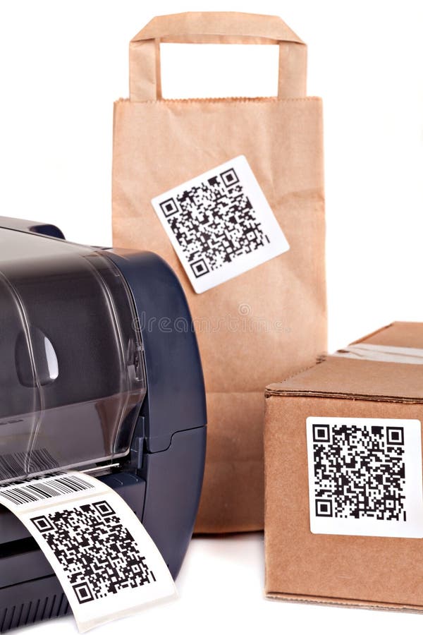 Barcode printer and packaging boxes marked with a bar code royalty free stock image