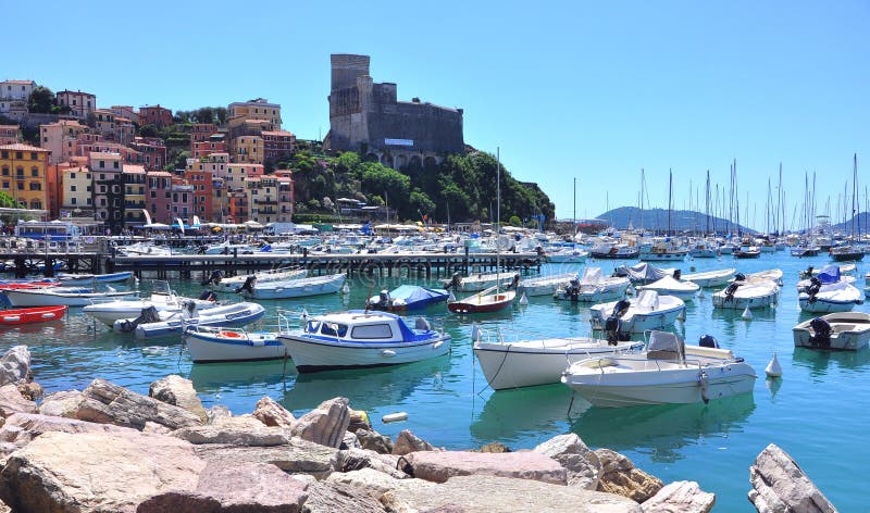 Boats on the Ligurian seashore in Italy. European tourism concept. Summer vacation at the sea. Boats on the Ligurian seashore in Italy. European tourism concept. Summer vacation at the sea.