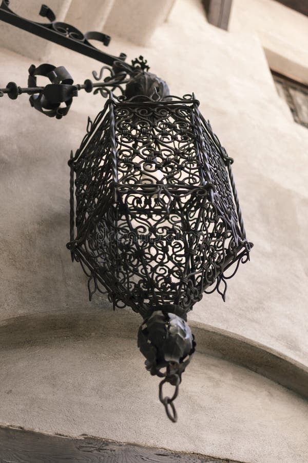 Very old medieval hammered lamp in the old city of Bran, Transylvania, Romania. Very old medieval hammered lamp in the old city of Bran, Transylvania, Romania