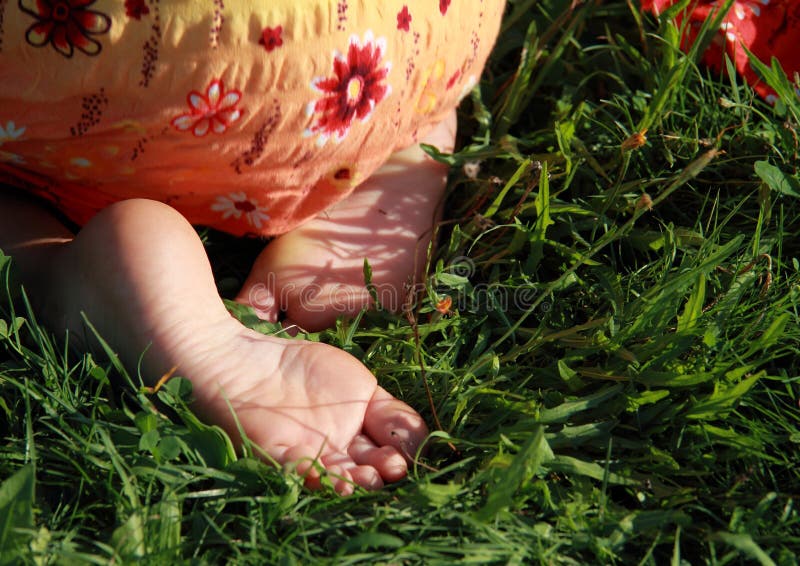 Bare feet of a little girl