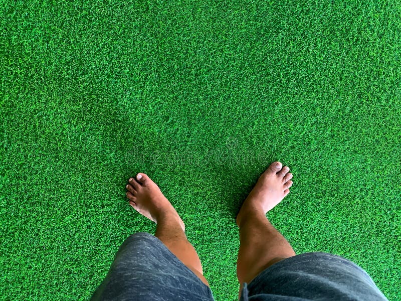 Barefoot on the artificial grass royalty free stock images