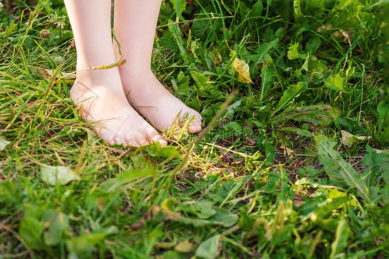 Bare Feet Of A Boy Standing On Grass Stock Image - Image of outdoors ...