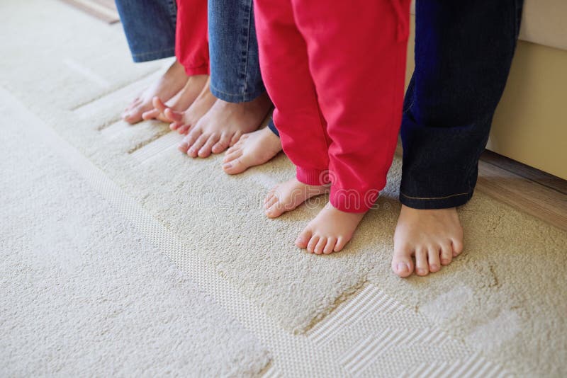 Barefoot family feet at home royalty free stock photo