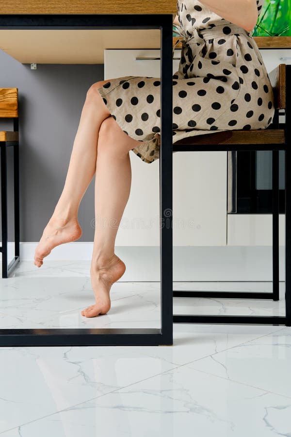 https://thumbs.dreamstime.com/b/barefoot-female-legs-under-table-side-view-barefoot-female-legs-under-table-home-215127076.jpg