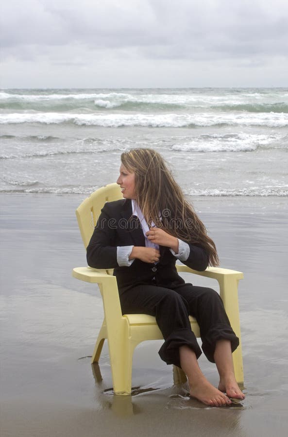 Barefoot Woman in Chair Looking Out To Sea