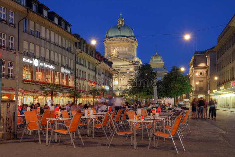 BERN, SWITZERLAND - JUNE 23: Barenplatz, with the Swiss Parliament Building looming over the square in Bern, Switzerland on June 23, 2012. Barenplatz (Bear Plaza) is build on the site of the second city wall and is today one of the focal points of the city. BERN, SWITZERLAND - JUNE 23: Barenplatz, with the Swiss Parliament Building looming over the square in Bern, Switzerland on June 23, 2012. Barenplatz (Bear Plaza) is build on the site of the second city wall and is today one of the focal points of the city.