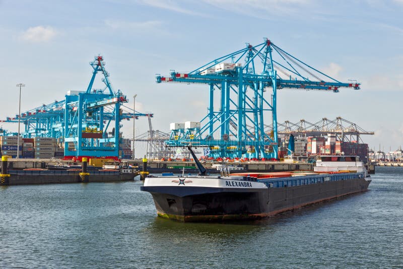 Barge on the Meuse river in the Port of Rotterdam. September 3, 2016 crane cranes harbor industrial tanker oil freight cargo industry ship shipping boat canal water traffic vessel transport carrier transportation waterway business maritime nautical shipment sea distribution commercial gas bulk delivery moving export container barges atlantic prestige maasvlakte apm terminals. Barges rotterdam stock images, royalty-free photos and pictures