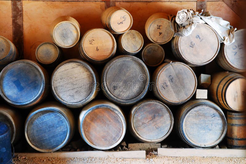 Barrels of different sizes for transporting different goods are stacked on top of each other in Jamestown, Virginia. Barrels of different sizes for transporting different goods are stacked on top of each other in Jamestown, Virginia