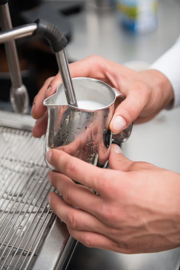 Barista Using Special Brush while Cleaning Parts of Coffee Machine