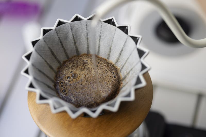 Barista Pouring Hot Water on Coffee Ground with Filter , Hand Drip
