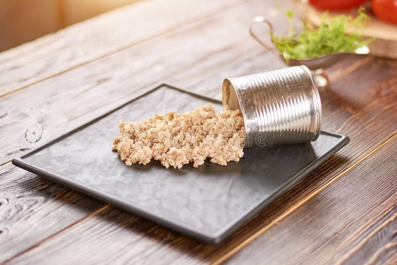 Barley pearl pouring out from can. stock images Barley pearl pouring out from can. stock images