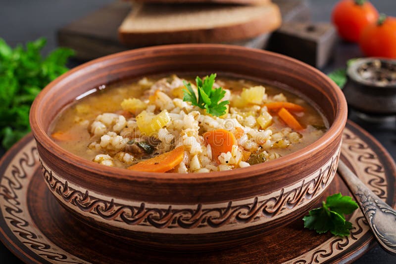 Barley soup with carrots, tomato, celery and meat