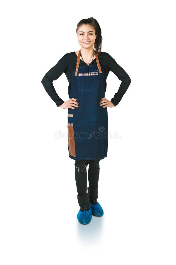 A shoot of young caucasian woman in apron as a barmen with arms akimbo. Isolated against white background.