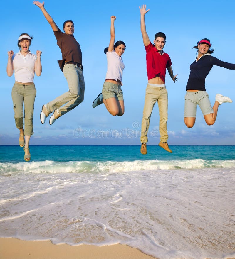 Jumping young people happy group vacation tropical beach. Jumping young people happy group vacation tropical beach