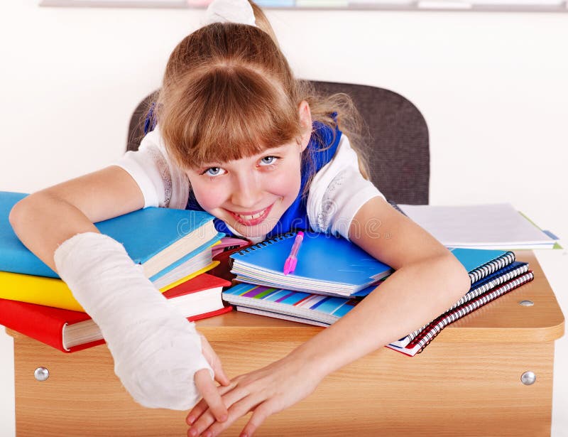 Child with broken arm in school. Child with broken arm in school.