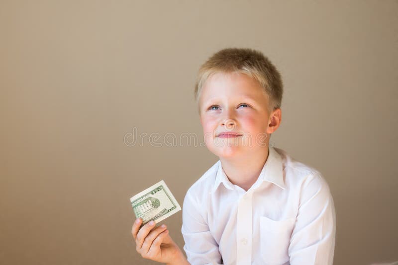 Barn med pengar (20 dollar) royaltyfri fotografi Barn med pengar (20 dollar) royaltyfri fotografi