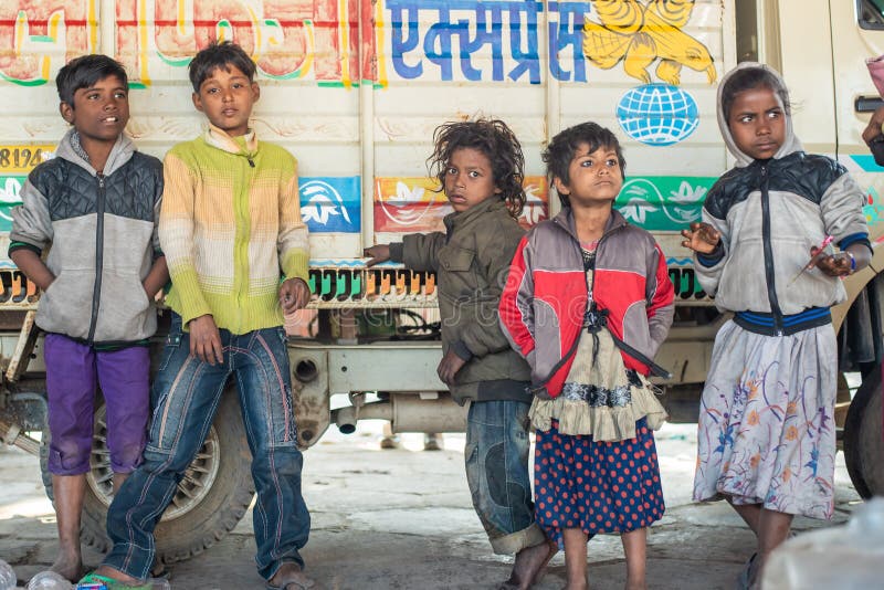Rajasthan. India. 07-02-2018. Group of street children on a break of their usual duties as collecting plastic or beg for money, living in a poor neighborhood in India. Rajasthan. India. 07-02-2018. Group of street children on a break of their usual duties as collecting plastic or beg for money, living in a poor neighborhood in India
