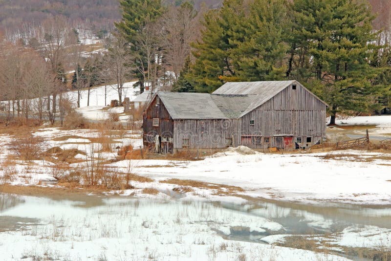 Old weathered barn in winter snow rural New York, rural poverty. Old weathered barn in winter snow rural New York, rural poverty