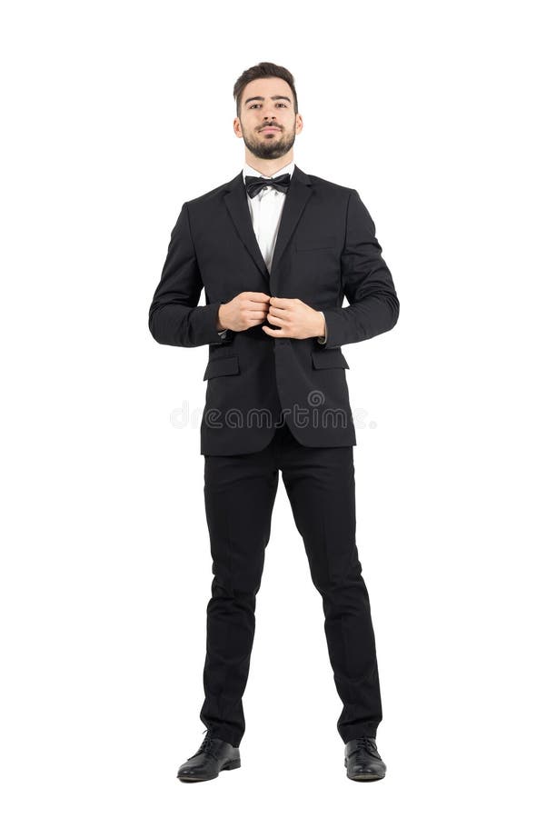 Barnet uppsökte den förmögna mannen som knäppas smokingen med flugan royaltyfri bild Barnet uppsökte den förmögna mannen som knäppas smokingen med flugan royaltyfri bild