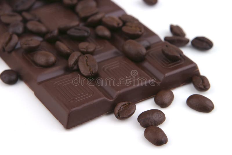 Dark chocolate bar over white background and coffee grain. Dark chocolate bar over white background and coffee grain