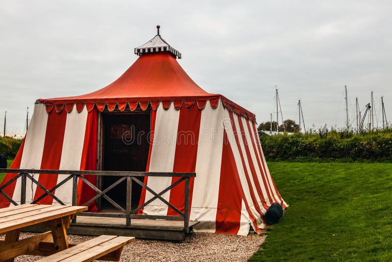 Ancient white-red tarpaulin tent in Muiderslot castle. Holland. Ancient white-red tarpaulin tent in Muiderslot castle. Holland