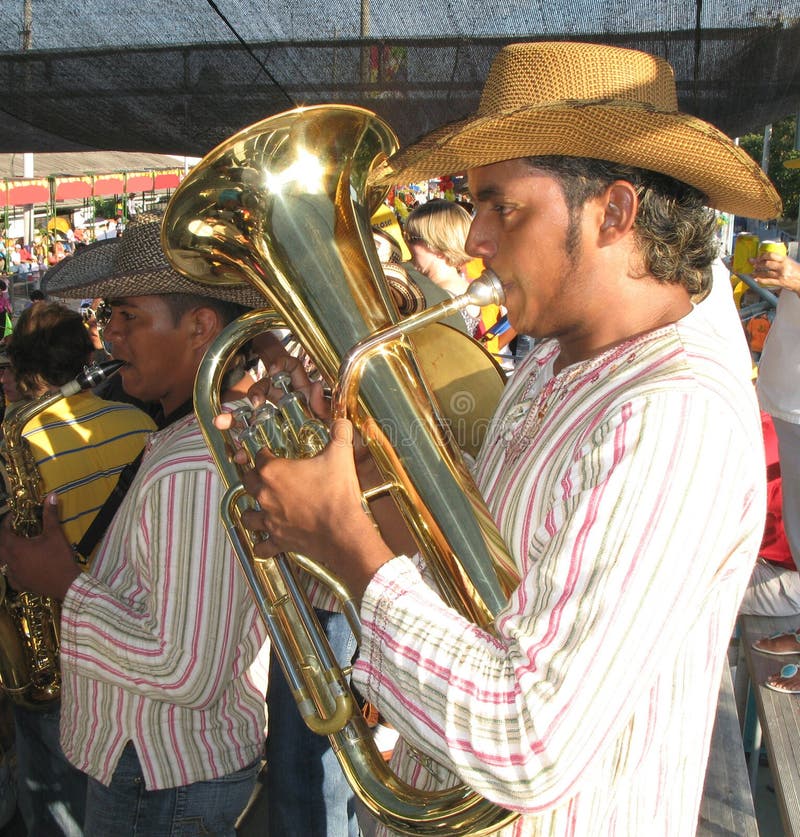 BARRANQUILLA, COLOMBIA- FEBRUARY 02: Men's Group playing on a wind instruments on a carnival in the city of Barranquilla. Barranquilla's Carnaval February 02, 2008 in Colombia. BARRANQUILLA, COLOMBIA- FEBRUARY 02: Men's Group playing on a wind instruments on a carnival in the city of Barranquilla. Barranquilla's Carnaval February 02, 2008 in Colombia.