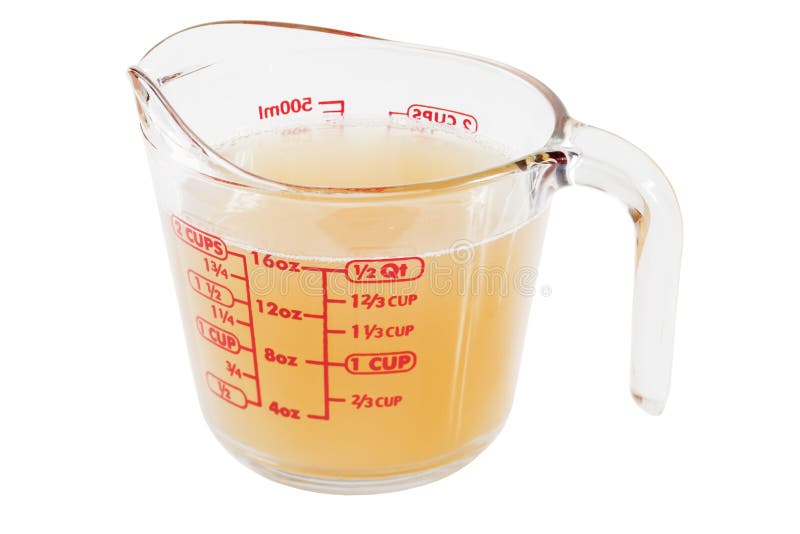 A glass measuring jug containing chicken stock, the basis of any good home made soup. A glass measuring jug containing chicken stock, the basis of any good home made soup.