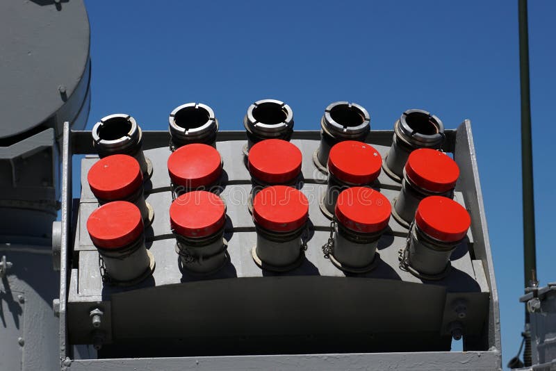 Barrels of military tank artillery gun on a blue sky background. copy space, selective focus, narrow depth of field. stock photography Barrels of military tank artillery gun on a blue sky background. copy space, selective focus, narrow depth of field. stock photography