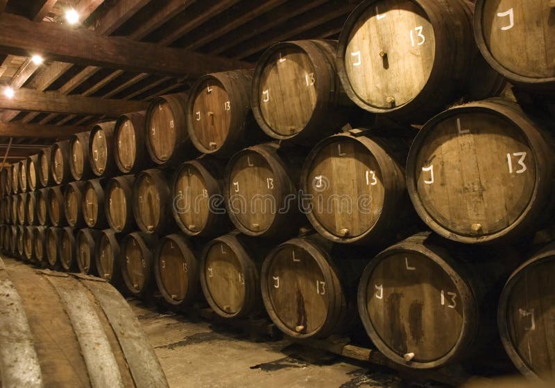 Barrels in brewery with beer waiting to be bottled. Barrels in brewery with beer waiting to be bottled