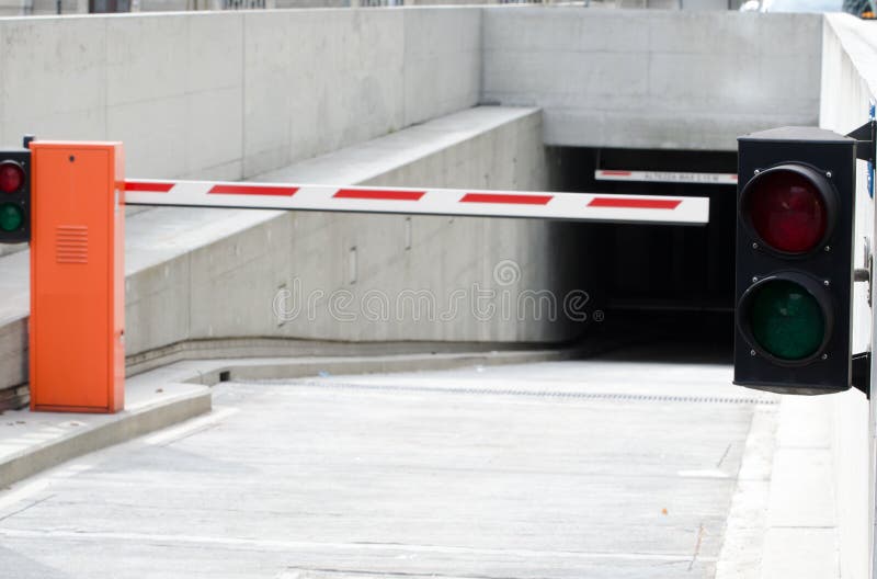 Barrier and a Traffic Light at the Entrance of an Underground Parking