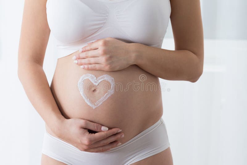 Barriga da mulher gravida fotografia de stock Barriga da mulher gravida fotografia de stock