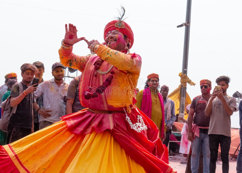 People celebrating colorful Holi festival at Barsana