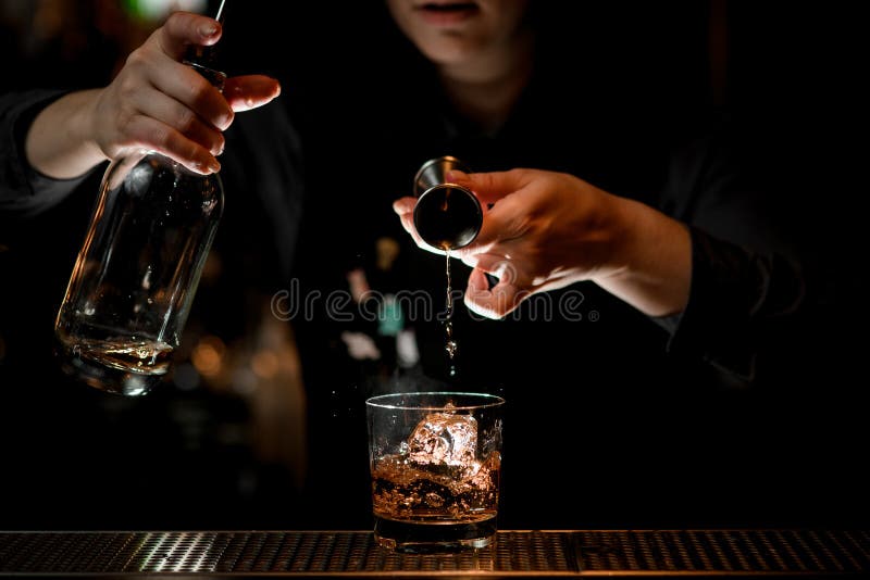 Brunette Woman Barman Carefully Pours Cocktail from Steel Shaker into Glass  Using Sieve. Stock Image - Image of hands, liqueur: 176636025