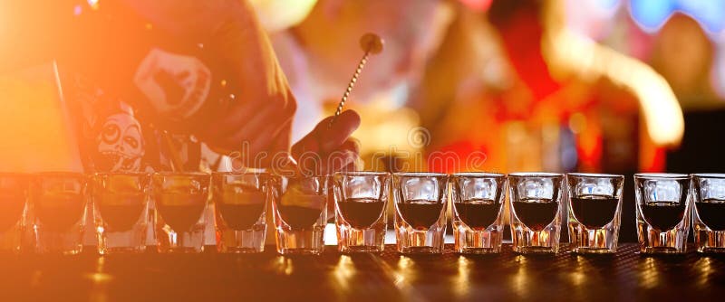 Bartender fills glasses stack cooks a lot of b52 stock photos Bartender fills glasses stack cooks a lot of b52 stock photos