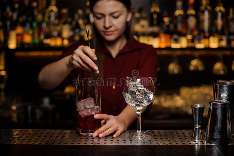 Bartender Girl Stiring a Fresh Light Red Cocktail Stock Image - Image ...