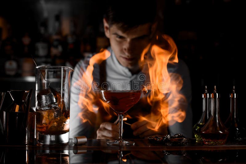 Bartender Watching on the Fire Around the Cocktail Glass Stock Photo -  Image of drink, glass: 153785724