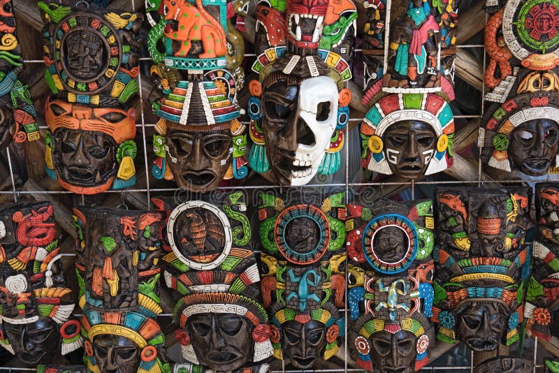 Colored wooden masks at a souvenir stand in Chichen Itza, Yucatan, Mexico. Colored wooden masks at a souvenir stand in Chichen Itza, Yucatan, Mexico.