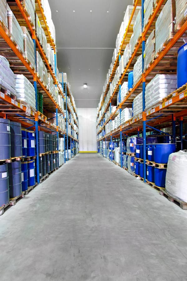 Barrels and boxes in big industrial warehouse. Barrels and boxes in big industrial warehouse